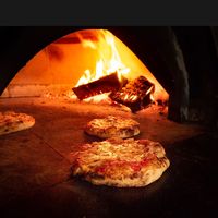 Kids pizzas in the oven  at Joe Pesto's in Squamish