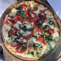 My small build-your-own pizza, which included olive oil (sans sauce), vegan cheese, roasted garlic, roasted red peppers and spinach.  at G's Pizza - Howard Ave in New Orleans