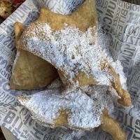 Vegan Beignets with plenty of powdered sugar to spare.  at G's Pizza - Howard Ave in New Orleans