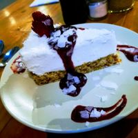 Coconut cheesecake, crispy bottom, soft, smooth, light and mouth melting coconut "cheese" and then raspberry (I think) sweet sauce. Masterpiece! at Give Cafe in Canggu