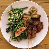Mixed custom plate with satay, grilled veggies and jackfruit curry   at Give Cafe in Canggu