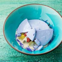 Cream of jasmine flowers, malt biscuit, caramelized rhubarb, fresh wild strawberries and blue tea merengue. at Barclay Restaurant in St Petersburg