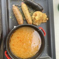 Sausages with sauerkraut soup  at Güjžina - Green One Bistro in Ljubljana