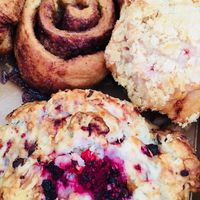 Baked goods like cinnamon rolls, scones and muffins at Sweet Pea Cafe & Playhouse in Edmonton