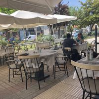 Outdoor tables at Valia Calda in Kalampaka