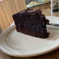 Chocolate, fudge and raspberry cake! (One of the best vegan cakes I’ve tried to date!) at Charlie's Cafe in North London