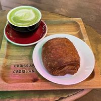 Vegan chocolate croissant and matcha latte with oat milk at Croissant Croissant in Montreal