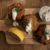 Vegan Crab Cakes with Tzaziki sauce  at Renegade Kitchen & Craft Bar in Kelowna