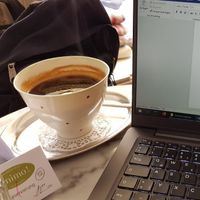 Work coffee served in cute handmade cup at Cafe Animo in Ulm