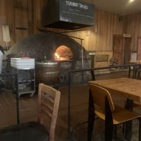 Pizza oven right in the dining room!   at Full Of Life Flatbread in Los Alamos
