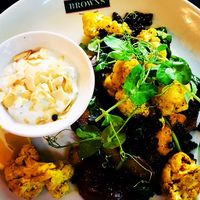 Curried cauli with mango and roast potato with pea shoots and mint and cucumber yoghurt at Browns in Birmingham