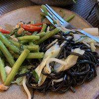 Morning glory stir fry and black noodles at Giggling Squid in Bath