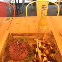 The cherry bomb burger and Tomarchio Aranciata   at Flower Burger in Palermo