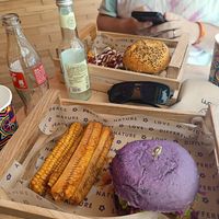 Hummus burger, funny crispy, corn rips and potato wedges at Flower Burger in Palermo