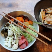 Mix rice bowl with vegetables and pickles (left) and zhong style dumplings (right) at Cai Kitchen in Hamburg