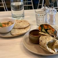 Hummus and Breakfast Burrito  at Comoba in Lisbon