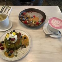 Chia porridge, Matcha pancakes, beetroot latte, ginger tea at Comoba in Lisbon