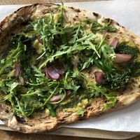 Houmous flatbread with broccoli and almond pesto at Hall and Woodhouse in Portishead