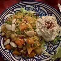 Magluba vegana, piatto giordano di riso speziato con carote, patate, uvetta e hummus  at Frary's in Venice