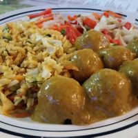 Tofu balls with curry, rice, and salad at Gomier's in Punta Gorda