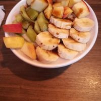 Porridge bowl with fresh fruit at Balans Café in Szczecin