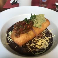 Vegetable chimichanga with vegan cheese. Comes with rice, refried beans, salsa, and guacamole.  at Blue Margarita in Bucharest