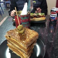 Philly cheesesteak in foreground and banh mi in the background   at Guac 'n' Roll in Liverpool