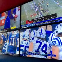 Televisions and large projection screens display every game! at Arooga's in East Brunswick