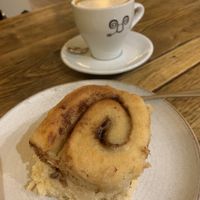 Vg cinnamon bun. It was warmed. Oat milk latte with caramel syrup  at Jaunty Goat - Bridge St in Chester