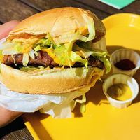 Iconic Burger w/ vegan patty, cheese, lettuce, tomato, pickles, grilled onions and secret sauce  at Plant Power Fast Food in Redlands