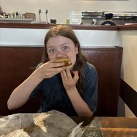 The second-born finally growing into her burger. 🥹  at Plant Power Fast Food in Redlands