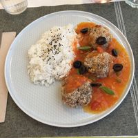 Veggie balls made from nuts, aubergines and soya served in a tomato based sauce with rice.  at Umami Good Food in Tenerife