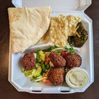 Falafel plate with baba ghanouj and dolmas. at PitaLicious in Austin