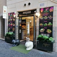Entrance in a quiet side street at Avocado Bar in Rome