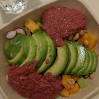 Avocado, melon, cucumber, red Hummus, peanuts at Avocado Bar in Rome