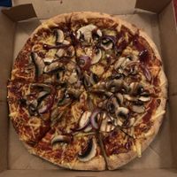 Vegan pizza Margherita (extra toppings: BBG swirl, red onion and mushrooms) at Domino's Pizza in Castricum