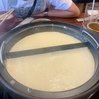 Making yuba at the table  at Okabeya in Kyoto