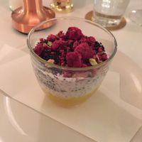 Yummie dessert 🍨 Chia pudding with shock frosted raspberries, nuts, sesame seed and mango purée  at Bills in Fukuoka