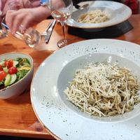 Pesto spaghetti and side salad at Torna a Surriento in Bangor