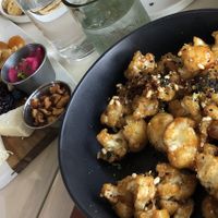 General Tso’s cabbage and Cheese Board, both vegan. at Naive in Louisville