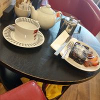 Pot of speciality tea (chilli chai) with vegan brownie at Murray's in Barmouth