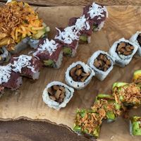 Top roll is amazing Zuchinni that taste like spicy crab, then harvest roll, mushroom roll,  and an amazing eggplant filled rolls topped with Avo and crunch  at Tomo Sushi & Ramen in Philadelphia