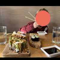 Green dragon (green) and harvest roll (orange) on left. Avocado roll on right.   at Tomo Sushi & Ramen in Philadelphia