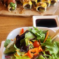 House salad with ginger dressing on the side at Tomo Sushi & Ramen in Philadelphia