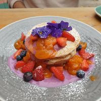 Pancakes with vegan yoghurt and berries at Gaard Coffee Hide in Sheffield