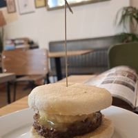 Delicious sausage patty, smoked cheese and hash brown muffin. at Gaard Coffee Hide in Sheffield