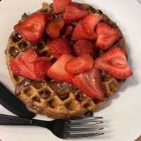 Waffle with strawberries, chocolate chips, and chocolate cream cheese drizzle   at Culture Coffee & Tea Bar in Virginia Beach