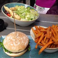 A vegan burger with sweet potato fries, and the vegan salad. at Hans im Glück in Leipzig