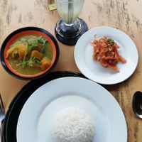 Burmese vegan curry and tomato salad at Bibo in Mandalay