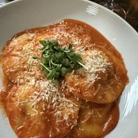 ravioli and greens in the back  at Pura Vita in West Hollywood